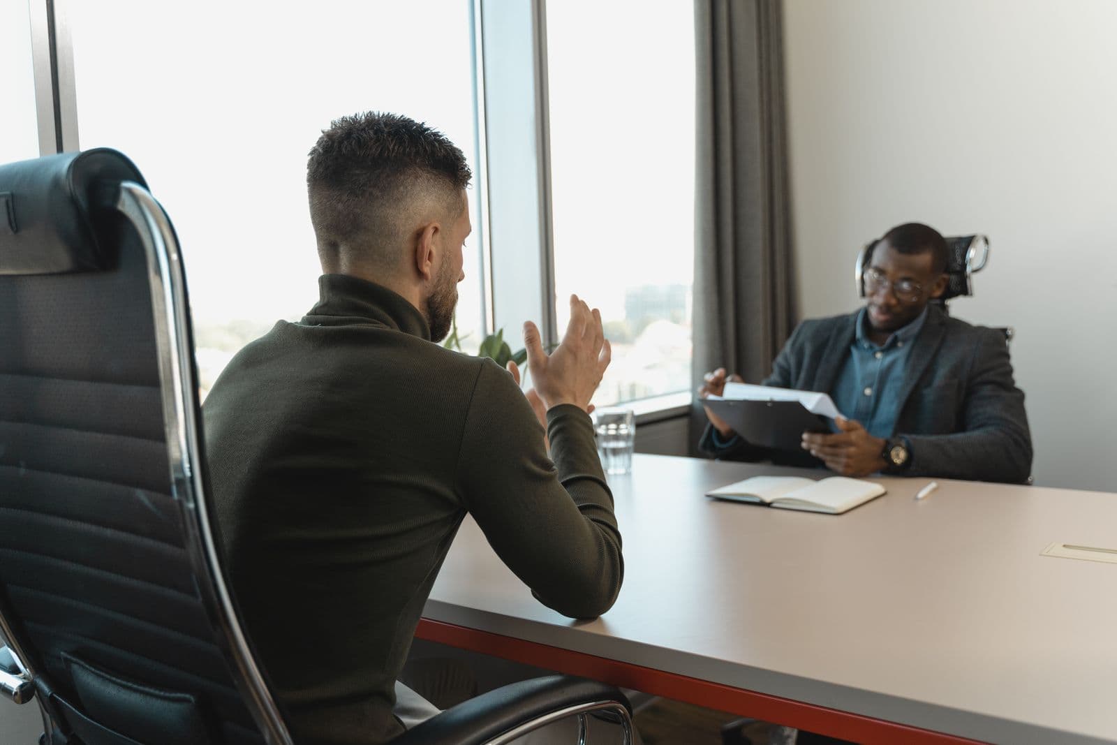 Colleagues reviewing a document together in an office